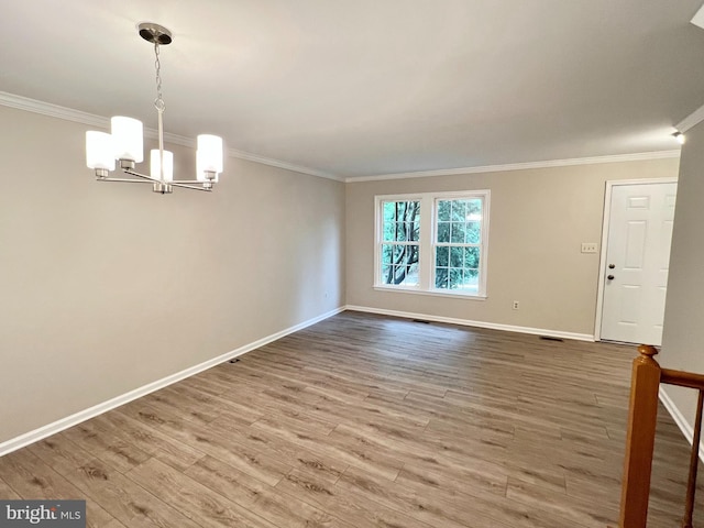 6062 Clay Spur Ct, Centreville, VA 20121 - spare room with ornamental molding, a chandelier, baseboards, and wood finished floors
