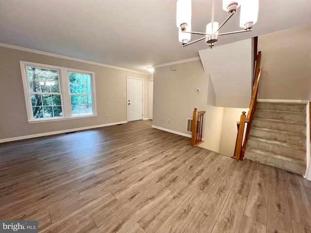 6062 Clay Spur Ct, Centreville, VA 20121 - unfurnished living room featuring wood finished floors, crown molding, a chandelier, baseboards, and stairs