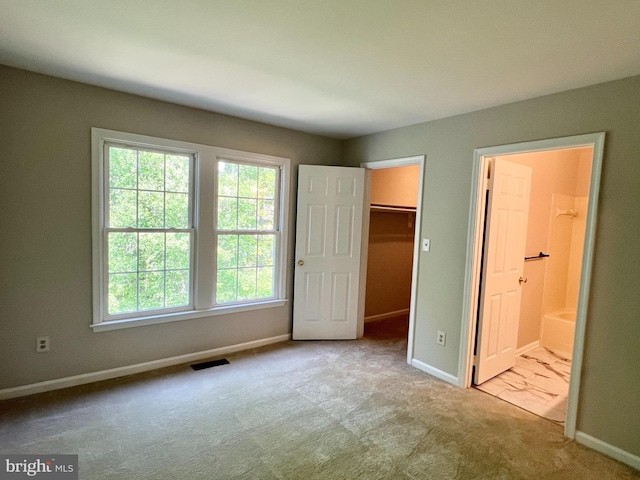6062 Clay Spur Ct, Centreville, VA 20121 - unfurnished bedroom featuring carpet, baseboards, a spacious closet, ensuite bathroom, and a closet