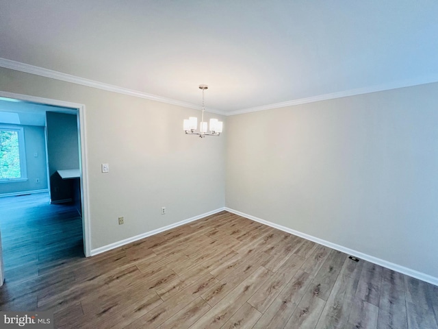 6062 Clay Spur Ct, Centreville, VA 20121 - unfurnished room with a chandelier, ornamental molding, wood finished floors, and baseboards
