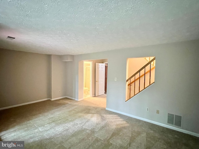 6062 Clay Spur Ct, Centreville, VA 20121 - empty room with stairway, carpet flooring, baseboards, and a textured ceiling