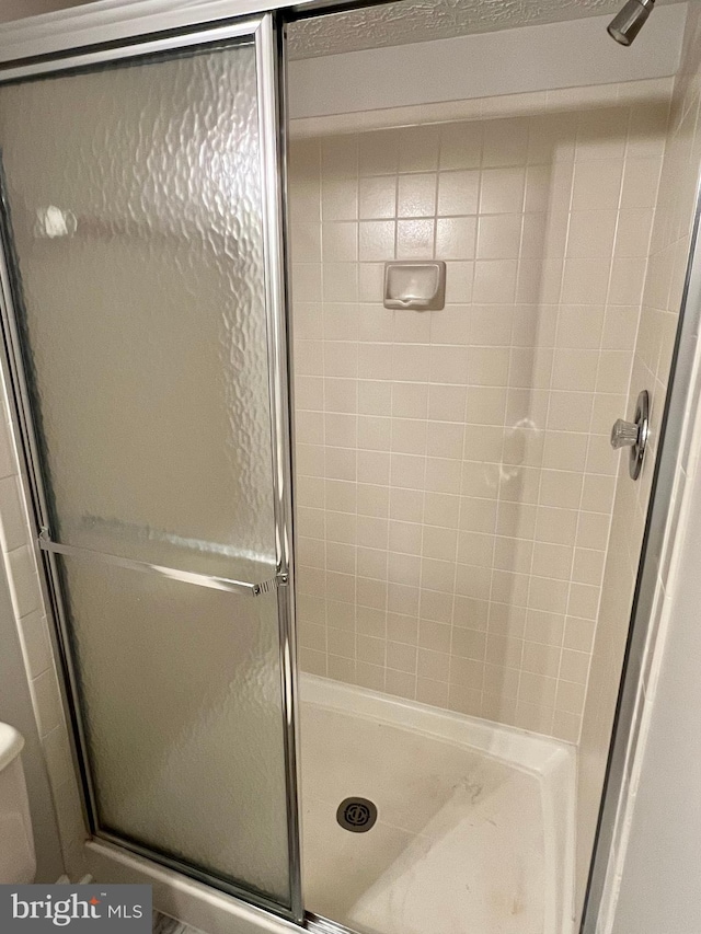 6062 Clay Spur Ct, Centreville, VA 20121 - bathroom featuring a shower stall and toilet
