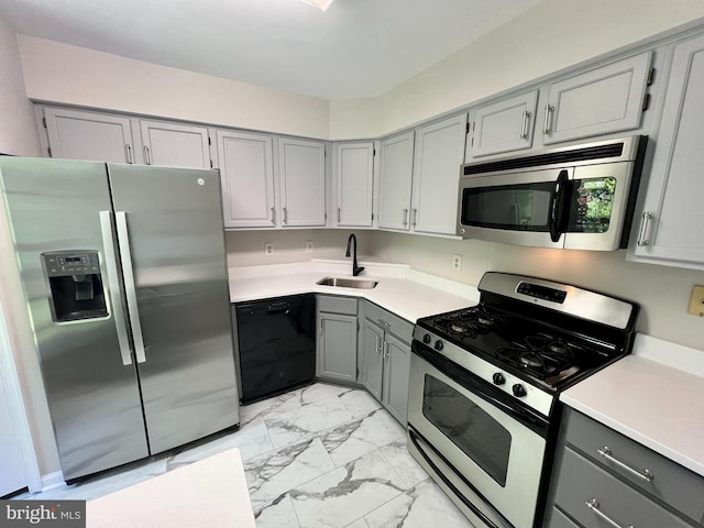 6062 Clay Spur Ct, Centreville, VA 20121 - kitchen featuring stainless steel appliances, gray cabinets, a sink, light marble finish floors, and light countertops