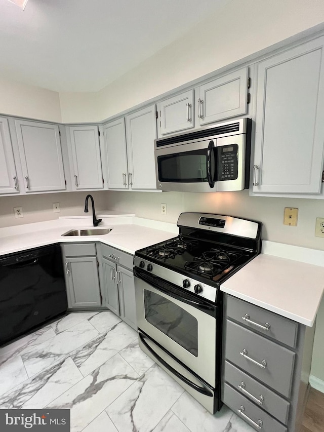 6062 Clay Spur Ct, Centreville, VA 20121 - kitchen featuring stainless steel appliances, gray cabinets, a sink, and light marble finish floors