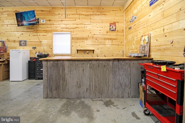 19 Old Hilltop Rd, Conowingo, MD 21918 - miscellaneous room with wood walls, concrete flooring, and a workshop area