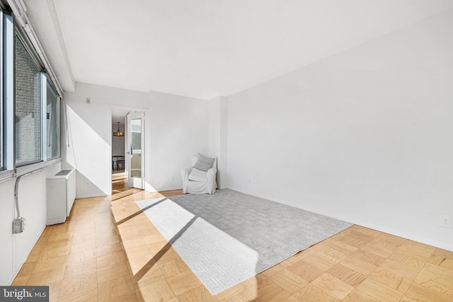 empty room featuring baseboards