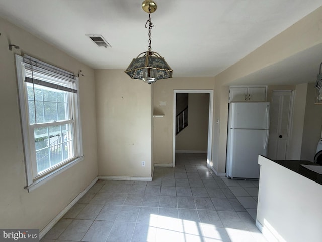 interior space featuring visible vents, stairs, baseboards, and light tile patterned floors