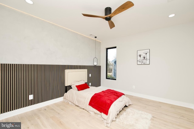 bedroom featuring recessed lighting, baseboards, ceiling fan, and wood finished floors