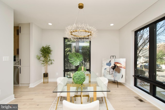 dining area featuring visible vents, baseboards, recessed lighting, a chandelier, and light wood finished floors