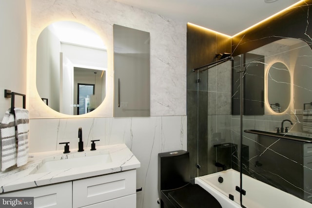 full bathroom with tile walls, decorative backsplash, vanity, and shower / bathtub combination