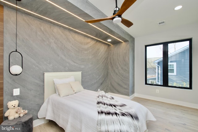 bedroom featuring recessed lighting, baseboards, visible vents, and wood finished floors