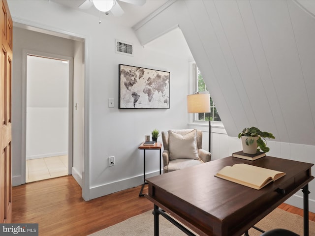 office featuring ceiling fan, light wood finished floors, and baseboards