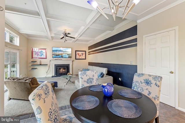 3401 Kidder Rd, Clinton, MD 20735 - dining space featuring a glass covered fireplace, beam ceiling, ceiling fan, a chandelier, and coffered ceiling