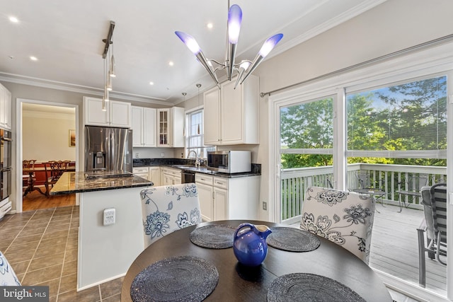 3401 Kidder Rd, Clinton, MD 20735 - kitchen featuring stainless steel refrigerator with ice dispenser, ornamental molding, a kitchen island, a chandelier, and white cabinetry