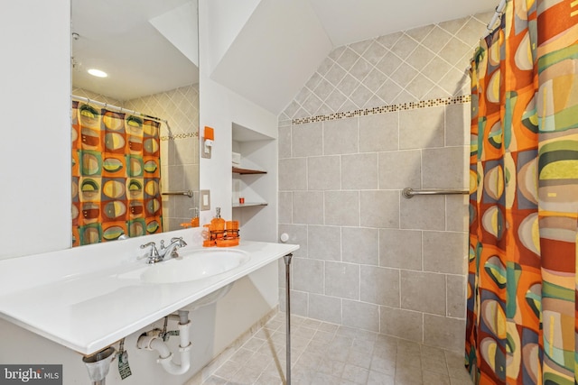 3401 Kidder Rd, Clinton, MD 20735 - bathroom featuring tiled shower, a sink, and tile patterned floors