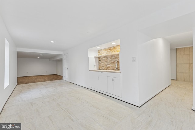 3401 Kidder Rd, Clinton, MD 20735 - unfurnished living room with recessed lighting, marble look tile flooring, and baseboards