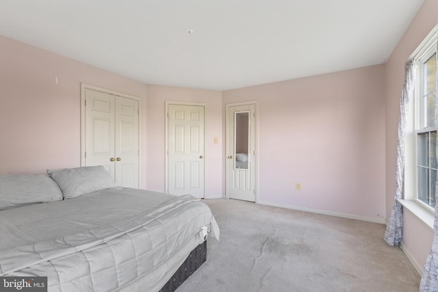 3401 Kidder Rd, Clinton, MD 20735 - bedroom with light colored carpet, baseboards, and a closet