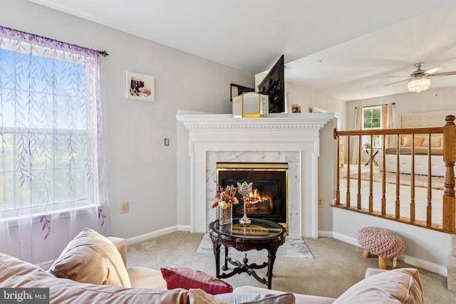 3401 Kidder Rd, Clinton, MD 20735 - carpeted living area with a high end fireplace, ceiling fan, and baseboards