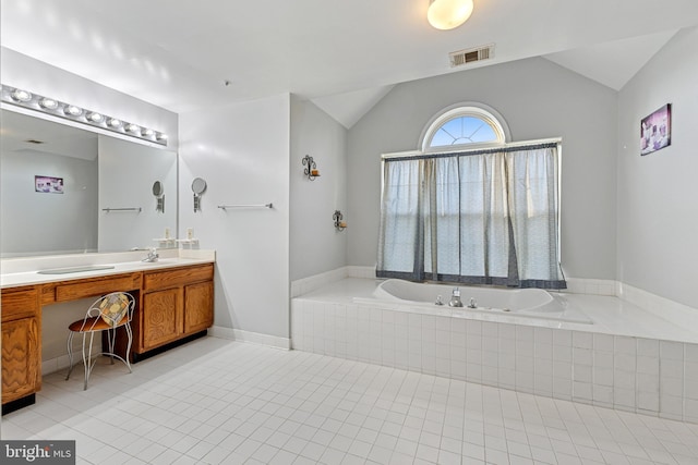 3401 Kidder Rd, Clinton, MD 20735 - bathroom with vaulted ceiling, a bath, vanity, and tile patterned floors
