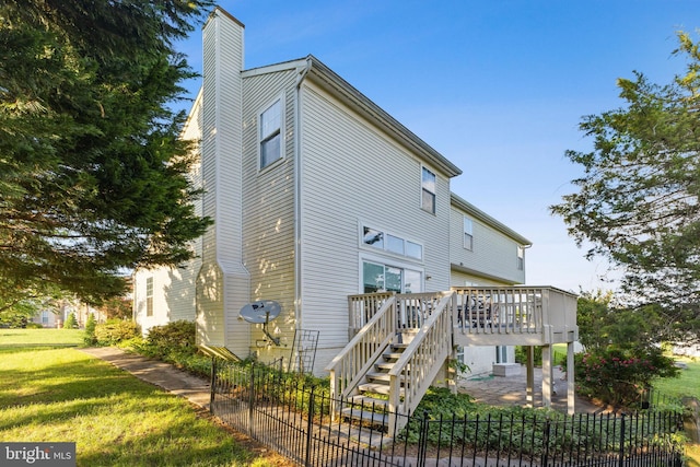 3401 Kidder Rd, Clinton, MD 20735 - rear view of property with a wooden deck, a chimney, and stairway
