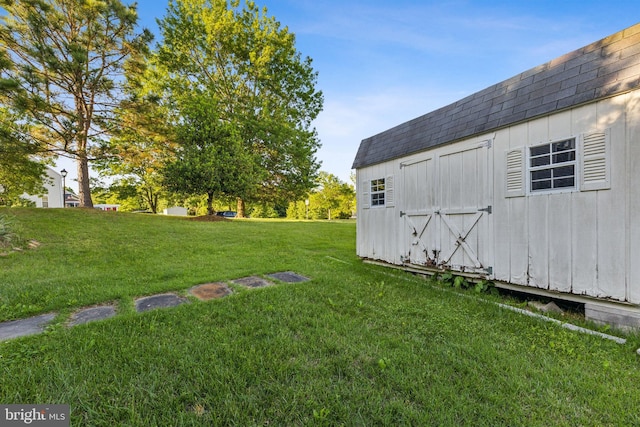 3401 Kidder Rd, Clinton, MD 20735 - view of green lawn with an outbuilding and a storage shed