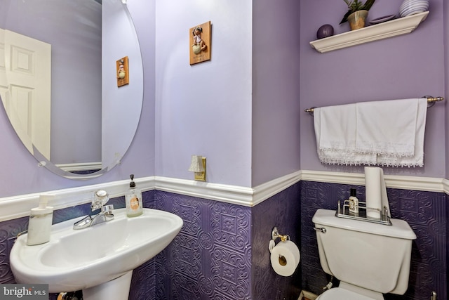 3401 Kidder Rd, Clinton, MD 20735 - half bath with a wainscoted wall, a sink, and toilet