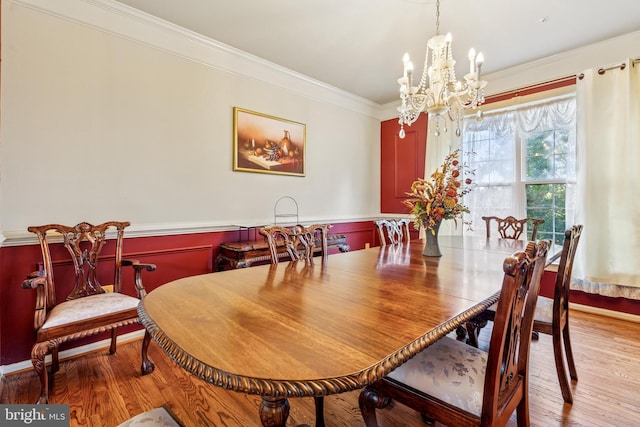 3401 Kidder Rd, Clinton, MD 20735 - dining space featuring a chandelier, ornamental molding, a wainscoted wall, and wood finished floors
