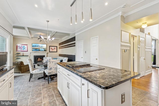 3401 Kidder Rd, Clinton, MD 20735 - kitchen featuring a lit fireplace, open floor plan, stovetop with downdraft, a center island, and ornamental molding