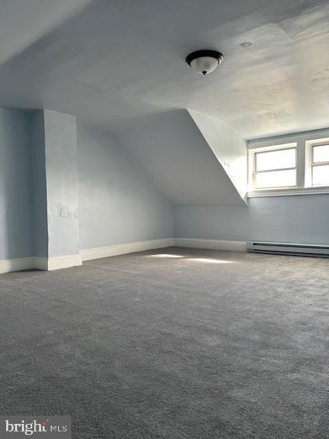 bonus room with baseboards, carpet, a baseboard heating unit, and vaulted ceiling