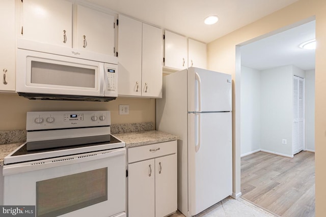 kitchen with light wood-style flooring, white appliances, recessed lighting, and white cabinets