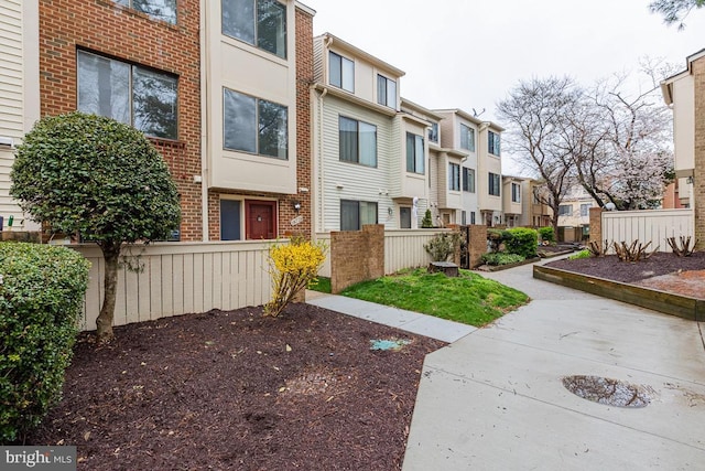 exterior space with fence and a residential view