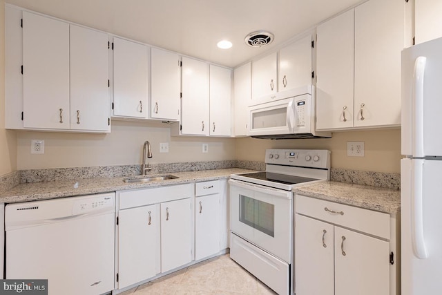 kitchen with a sink, white cabinets, visible vents, white appliances, and recessed lighting