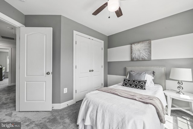 bedroom featuring ceiling fan, visible vents, baseboards, a closet, and carpet