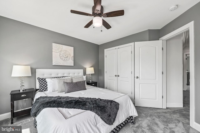 bedroom featuring baseboards, carpet flooring, a ceiling fan, and a closet