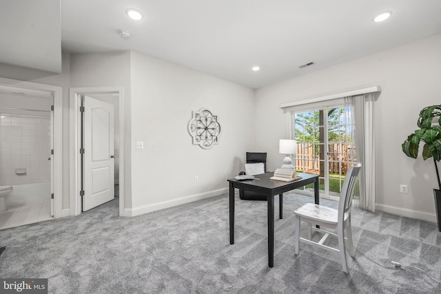 carpeted office space featuring recessed lighting, baseboards, and visible vents