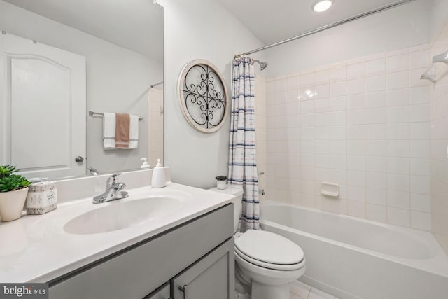 full bath featuring vanity, tile patterned flooring, toilet, and shower / bath combination with curtain
