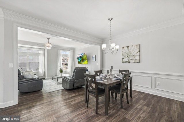 dining area with dark wood-type flooring, baseboards, and crown molding