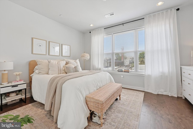 bedroom with visible vents, recessed lighting, baseboards, and hardwood / wood-style flooring