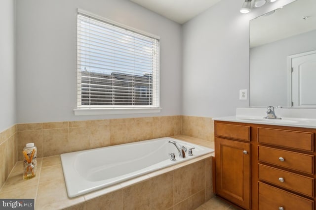 full bathroom featuring vanity and a bath