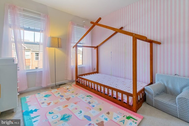 carpeted bedroom featuring wallpapered walls