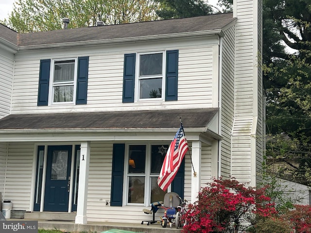 1 Noblewood Ct, Gaithersburg, MD 20878 - view of front facade featuring a chimney and a porch