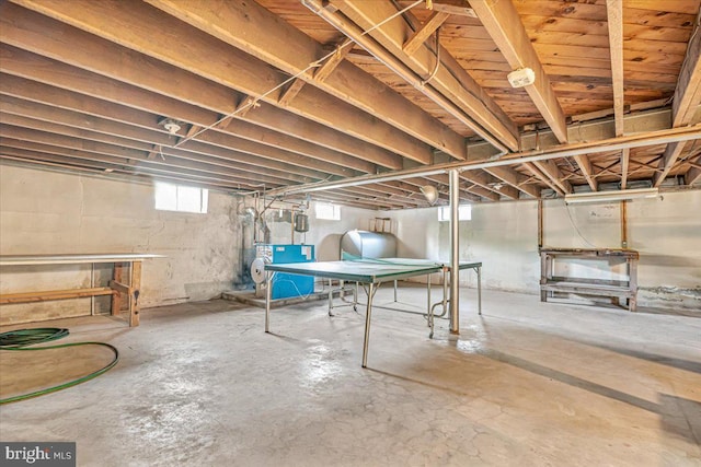basement featuring a heating unit and heating fuel