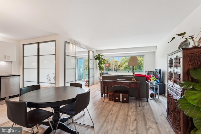 dining room with light wood-style floors