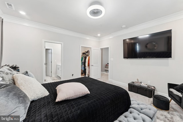bedroom with a walk in closet, ornamental molding, baseboards, and recessed lighting