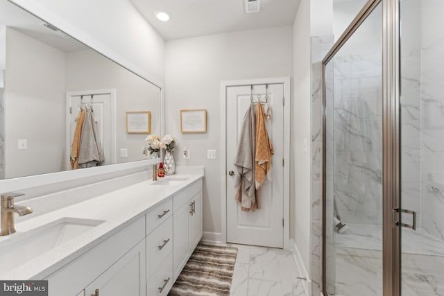 full bath featuring visible vents, a marble finish shower, a sink, and marble finish floor