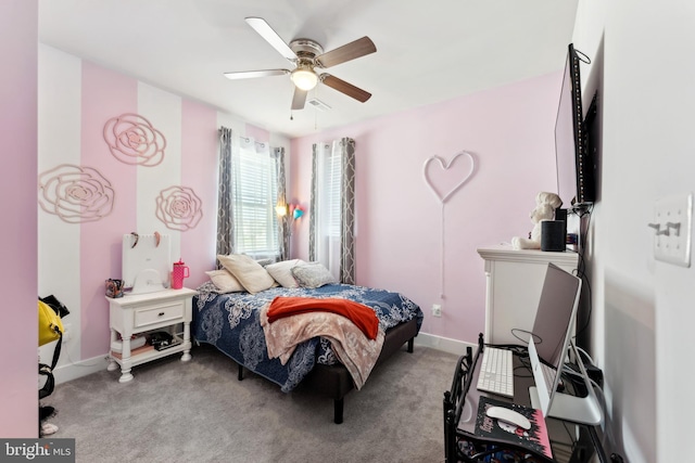 carpeted bedroom featuring baseboards, ceiling fan, and visible vents