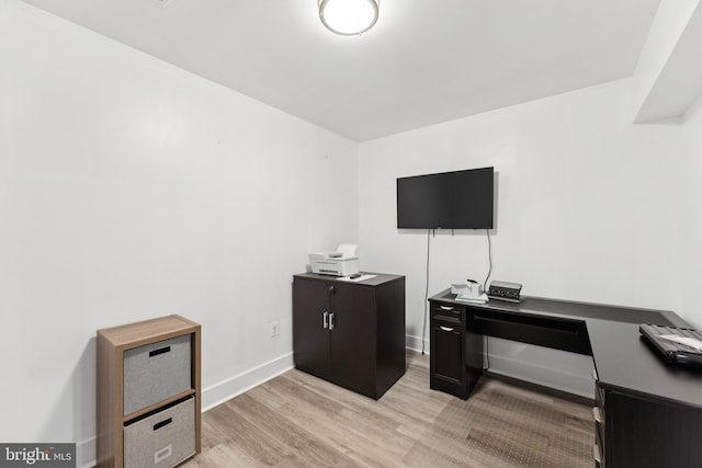 office with baseboards and light wood-type flooring