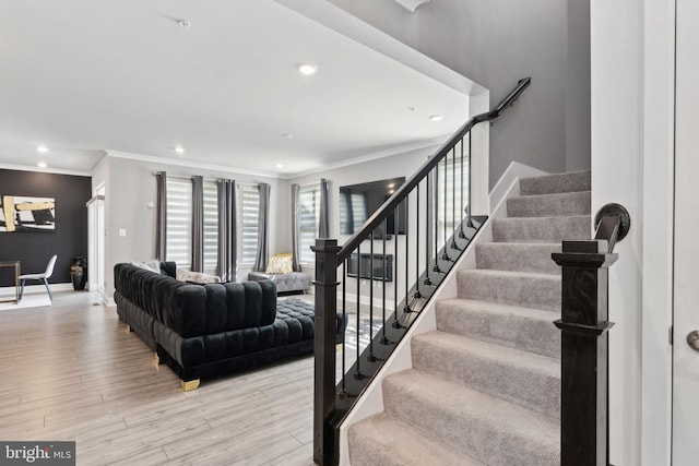 living room with stairway, ornamental molding, light wood-type flooring, and recessed lighting