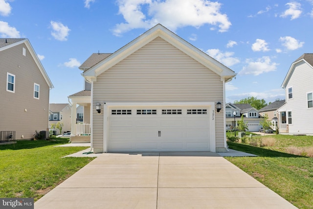 view of front of house with a front lawn, central AC, a residential view, and concrete driveway