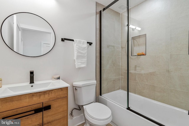 full bath featuring toilet, enclosed tub / shower combo, and vanity